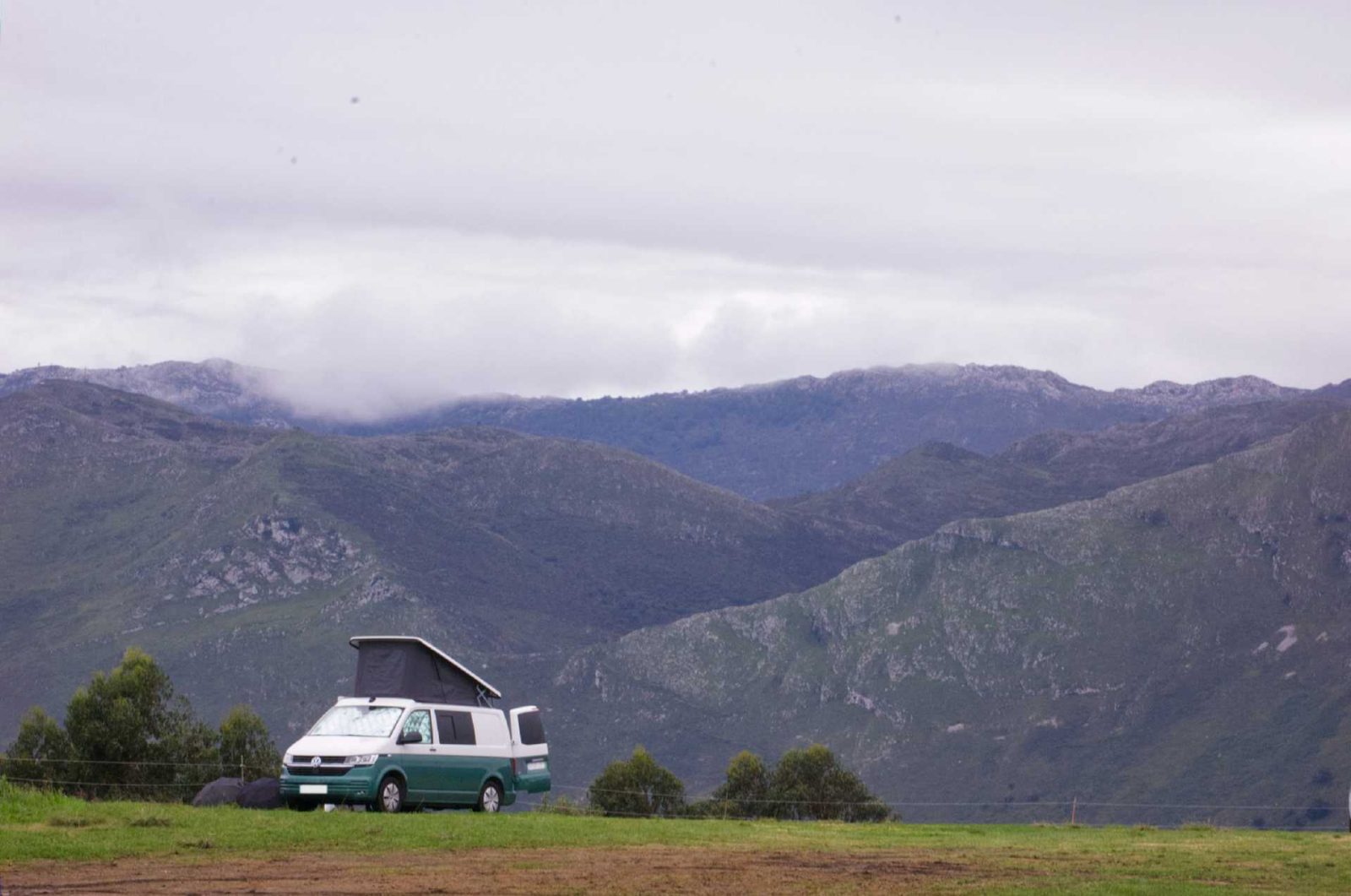 A campervan parked up on the hill